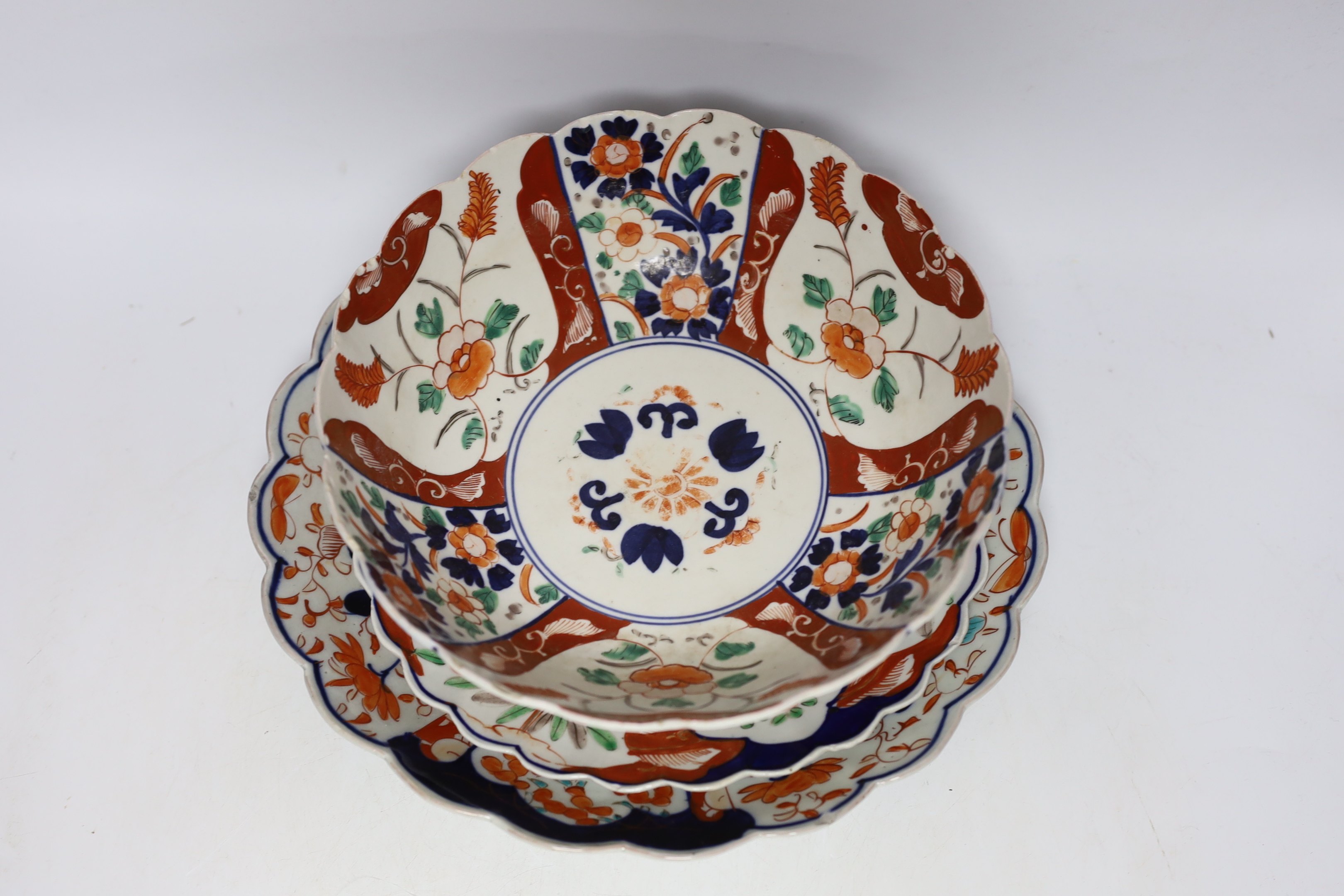 A group of Japanese Imari plates, dishes, a bowl and a vase